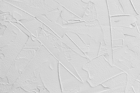 sfondo astratto bianco di stucco in pasta e intonaco adesivo con trattini e tratti irregolari